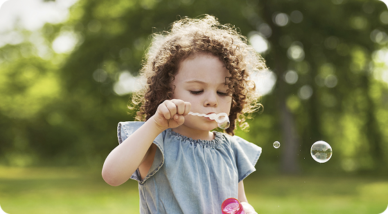 Reducing the Frequency of TSC Associated Seizures | Young Girl Blowing Bubbles